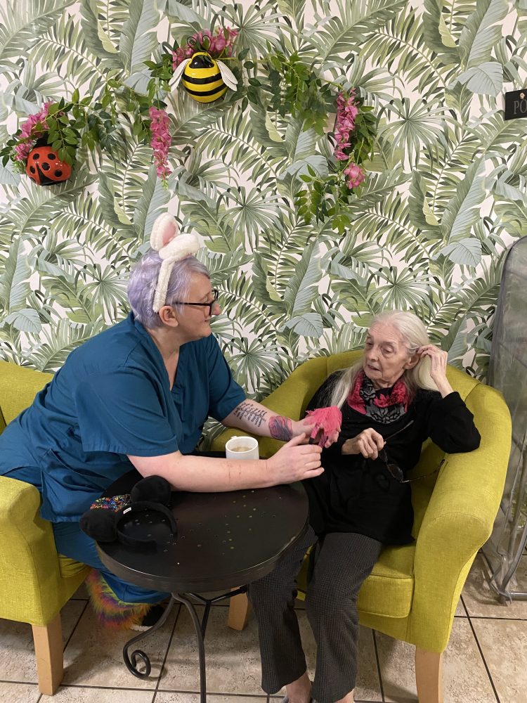 Debbie, a carer at Kingston Court care home in Carlisle, has a chat with one of our residents. 